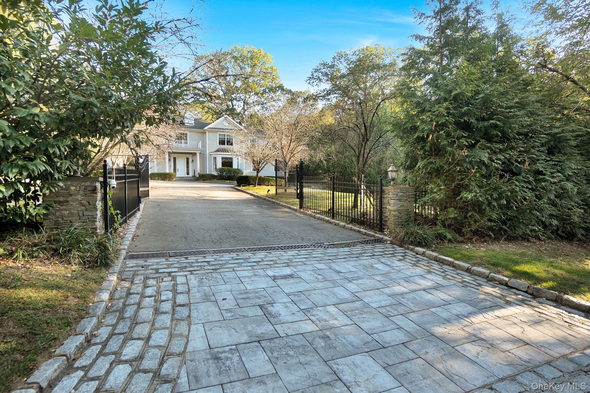 1 Norgate Road Glen Head, NY 11545 - Photo 4 of 42 a view of a yard with plants and a bench