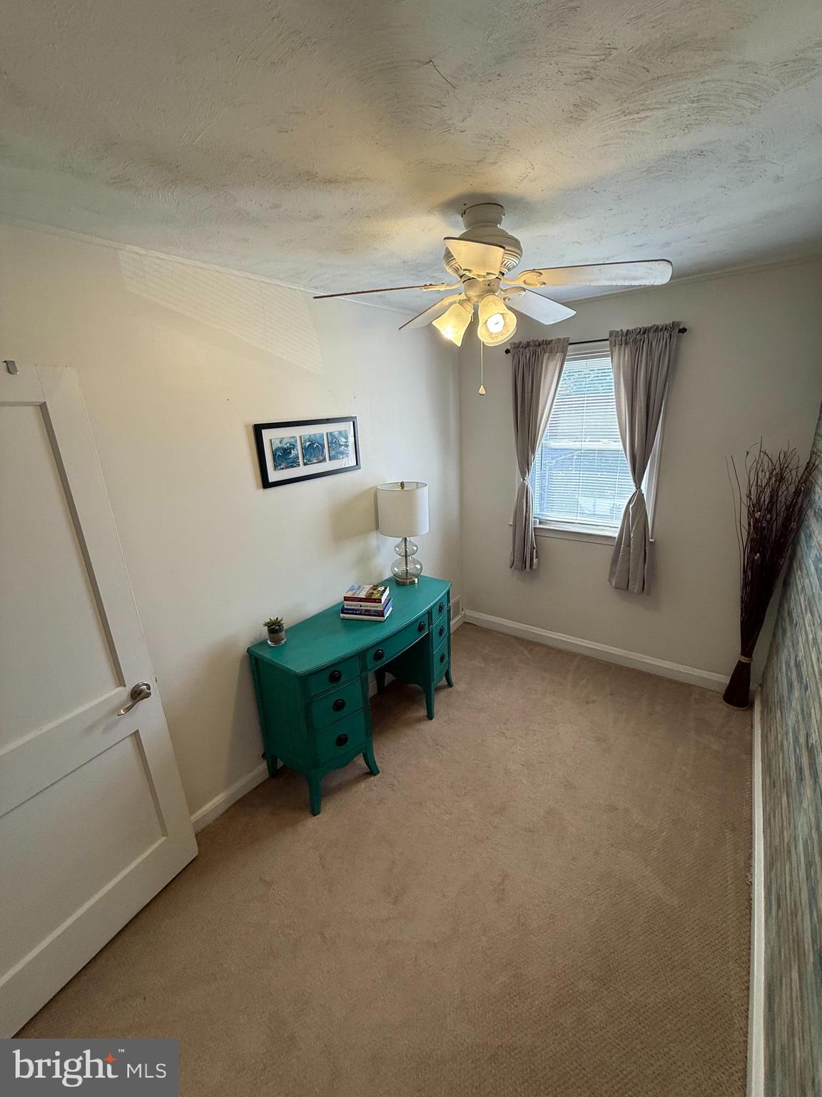 2235 Hawthorne Road Baltimore, MD 21220 - Photo 17 of 35 a room with furniture and a window