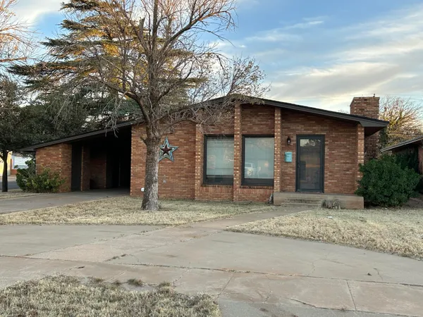 a house with a tree in front of it