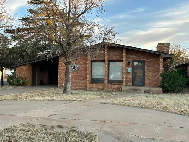 a house with a tree in front of it