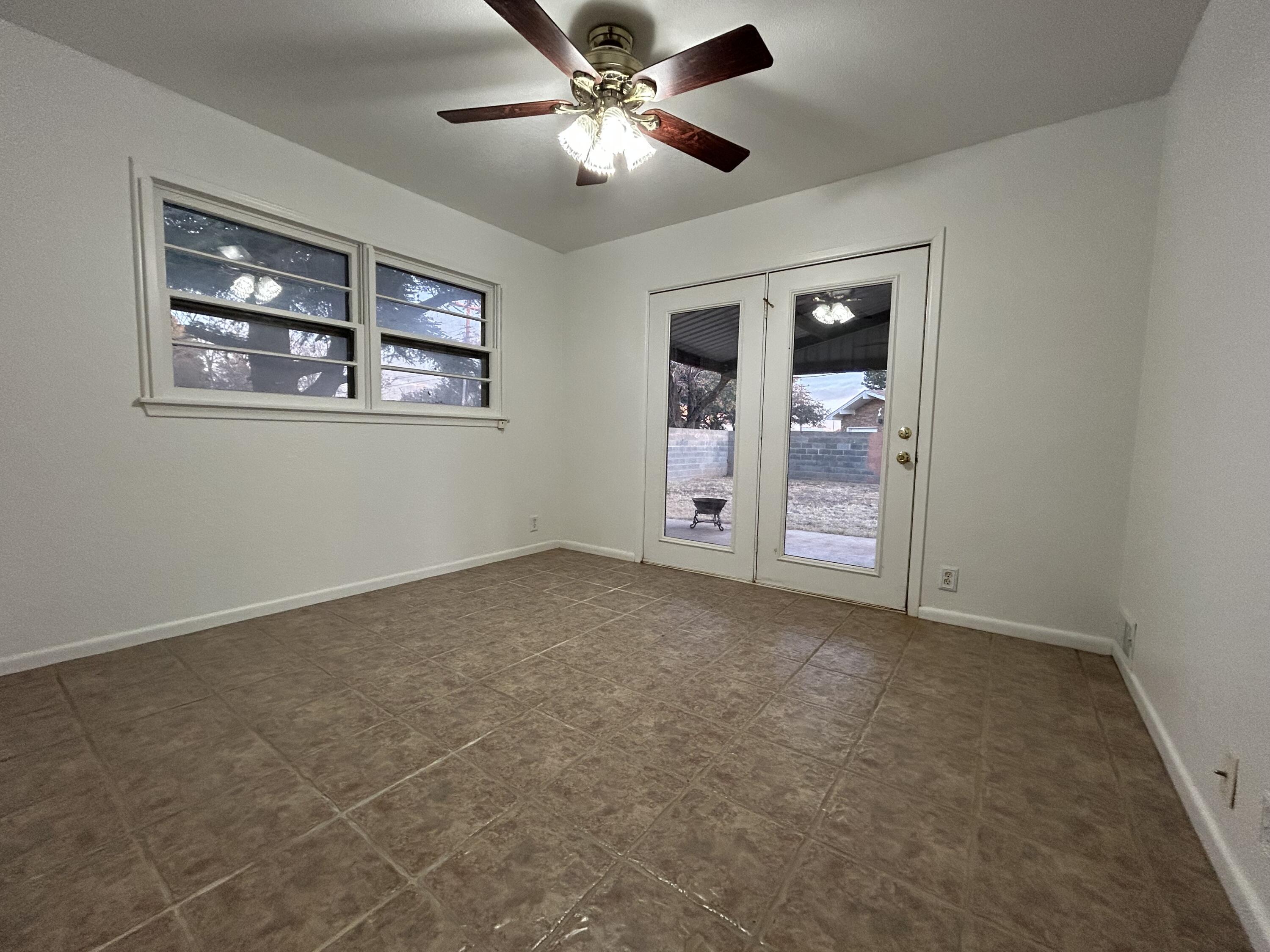 801 North 18th Street Lamesa, TX 79331 - Photo 14 of 15 a view of an empty room with a fan