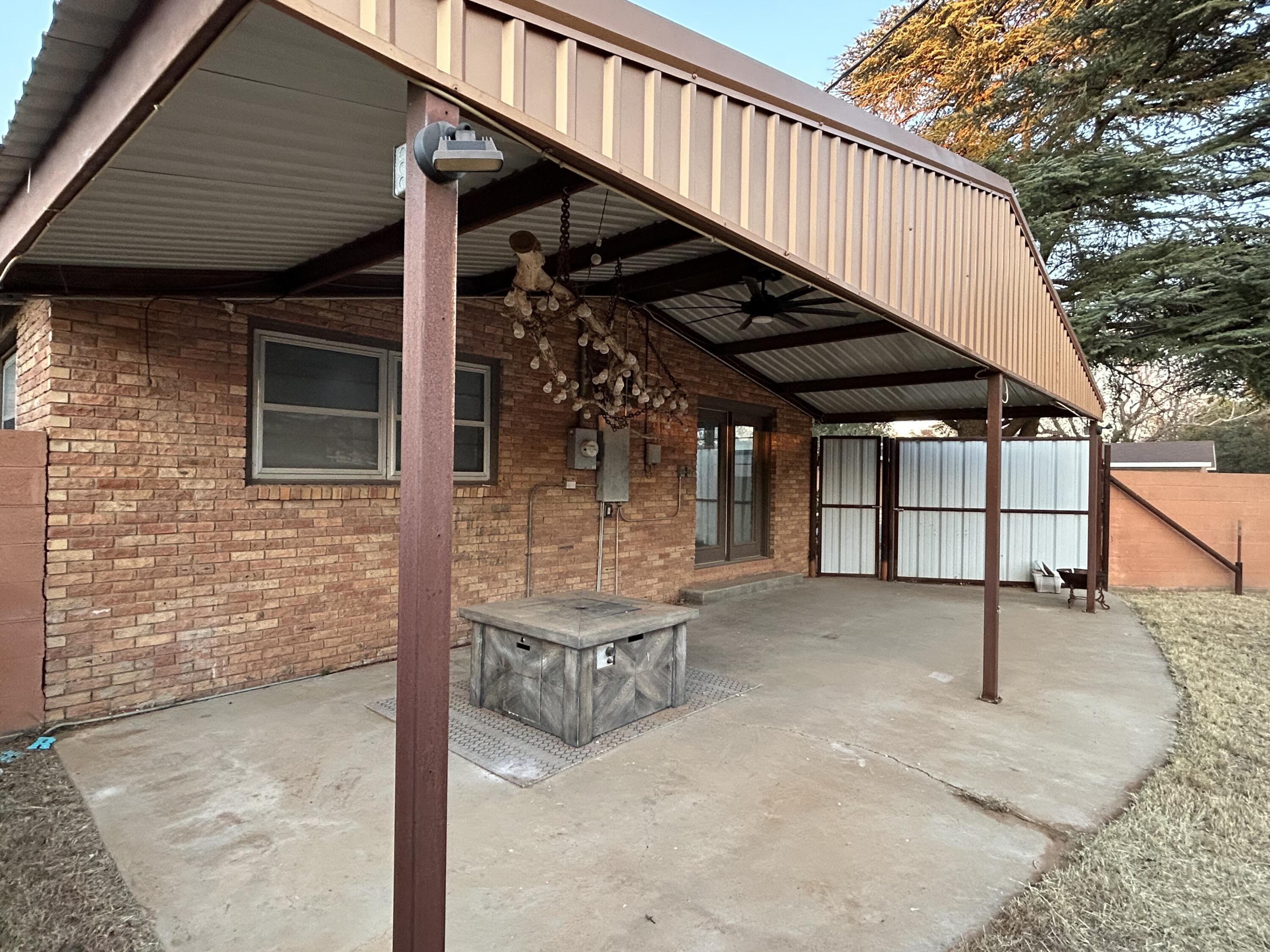 801 North 18th Street Lamesa, TX 79331 - Photo 15 of 15 a view of a balcony with furniture and wooden floor