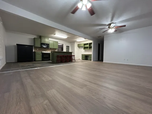 a view of a livingroom with a kitchen