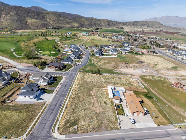 296 West Olympic Lane, Unit 2 Elk Ridge, UT 84651 - Photo 14 of 14 Aerial overview of property's location featuring nearby suburban area and mountains