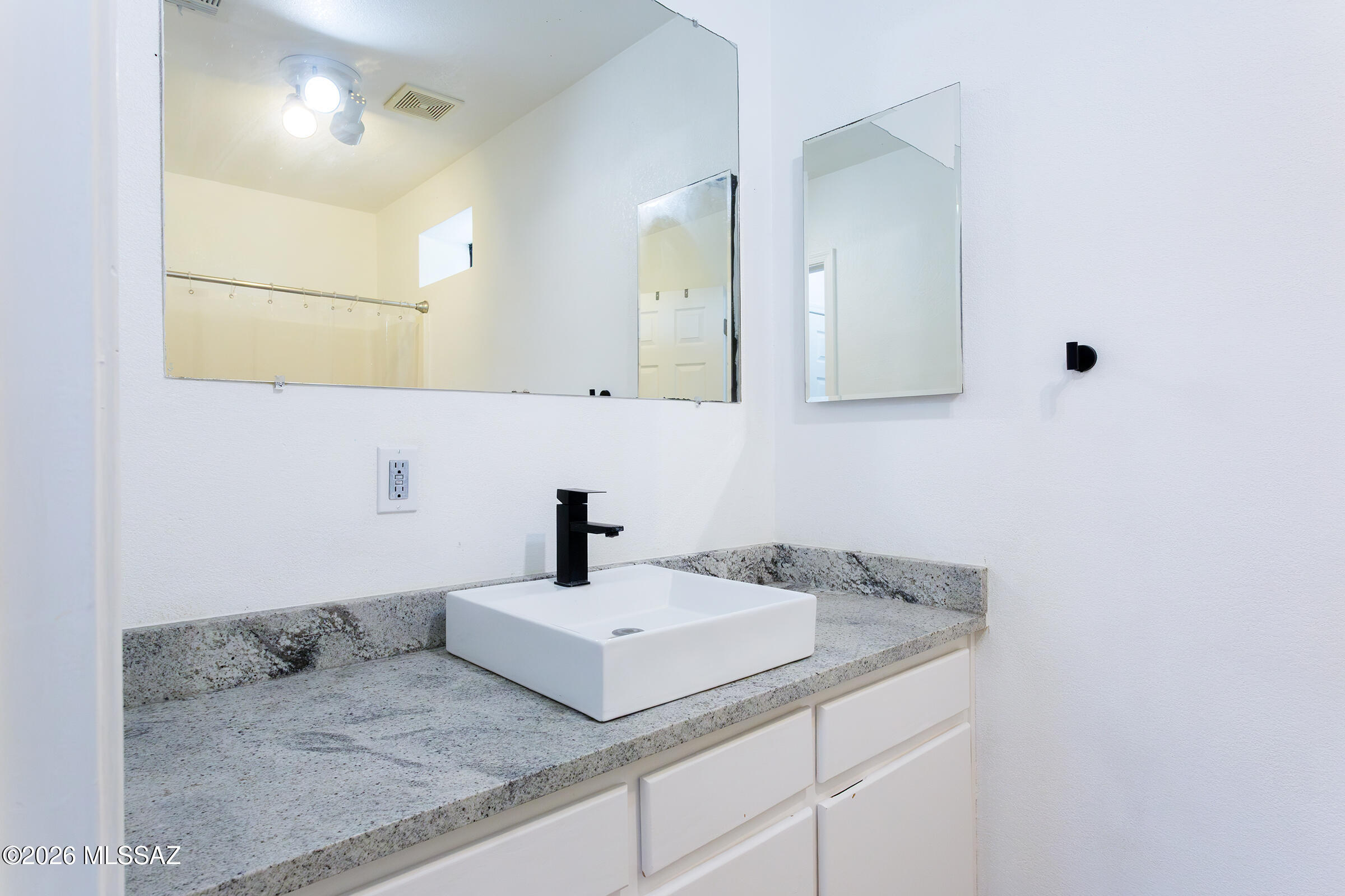 1081 Paseo Freno Rio Rico, AZ 85648 - Photo 25 of 46 a bathroom with a sink and a mirror