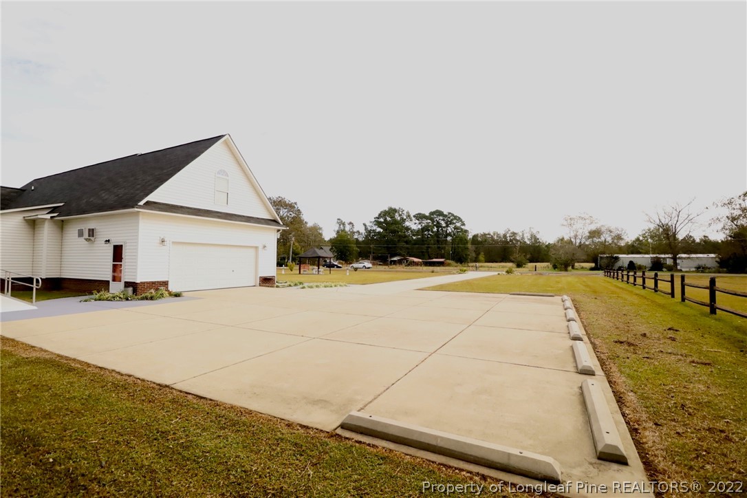 6087 Roebud Road Stedman, NC 28391 - Photo 7 of 31 a view of a house with swimming pool