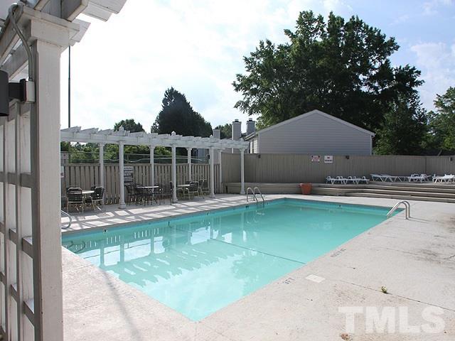 2432 Condor Court, Unit 2432 Raleigh, NC 27615 - Photo 11 of 11 a view of a house with pool and a yard