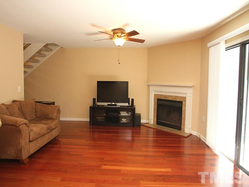 2432 Condor Court, Unit 2432 Raleigh, NC 27615 - Photo 3 of 11 a living room with furniture and a flat screen tv