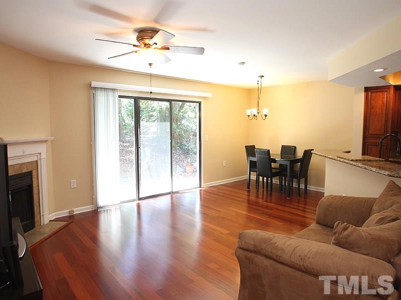 2432 Condor Court, Unit 2432 Raleigh, NC 27615 - Photo 4 of 11 a living room with furniture and a fireplace