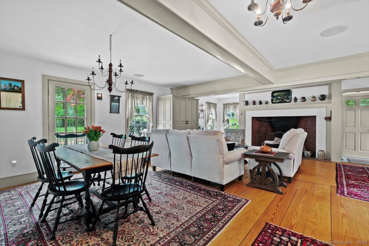 174 Bethel Road Griswold, CT 06351 - Photo 14 of 40 a living room with furniture and a fireplace