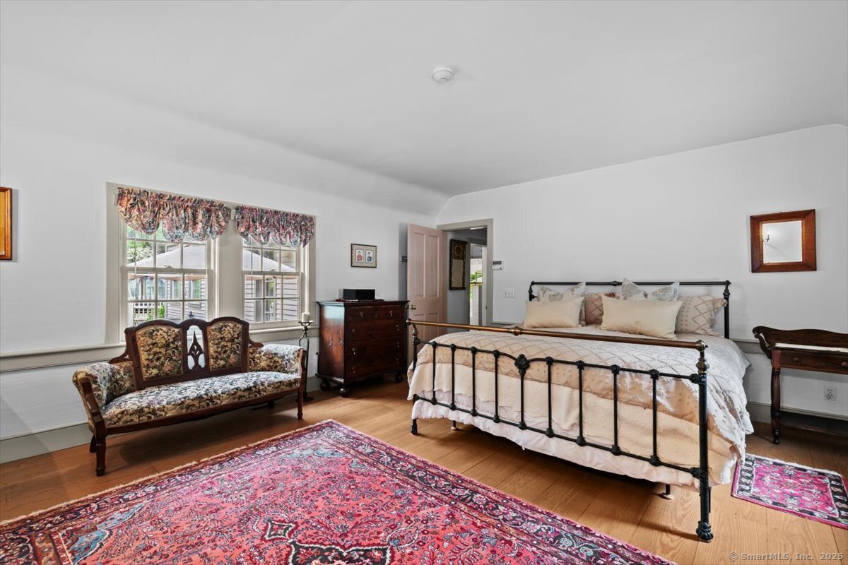 174 Bethel Road Griswold, CT 06351 - Photo 18 of 40 a bedroom with a bed couch and a window