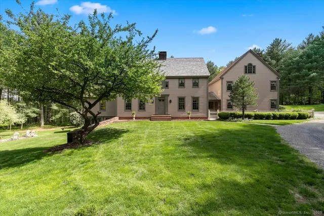 a front view of house with yard and green space