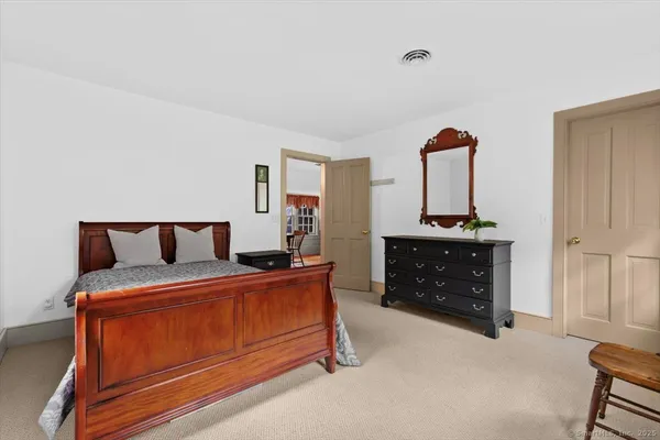 a bedroom with furniture and natural light