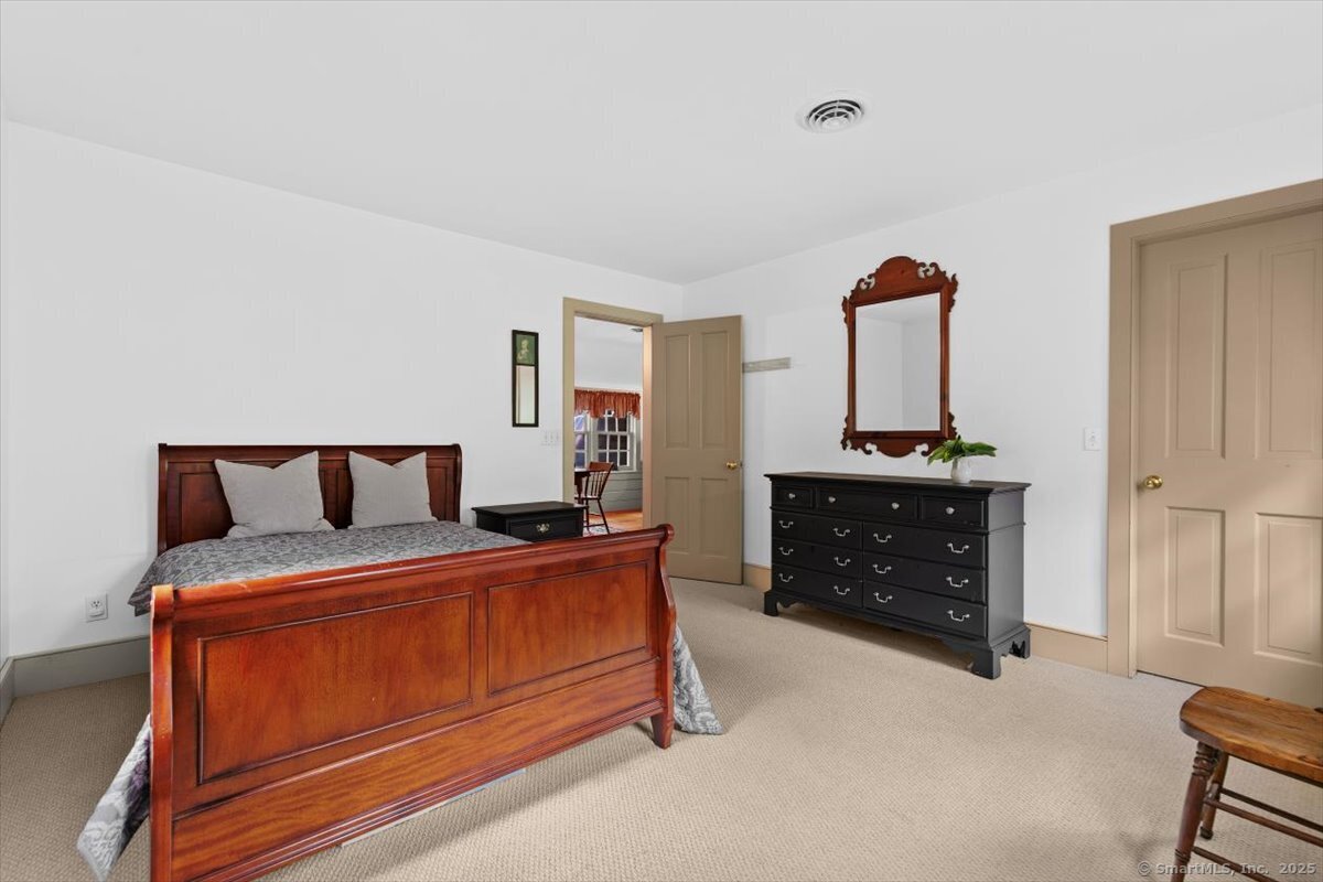 174 Bethel Road Griswold, CT 06351 - Photo 23 of 40 a bedroom with furniture and natural light