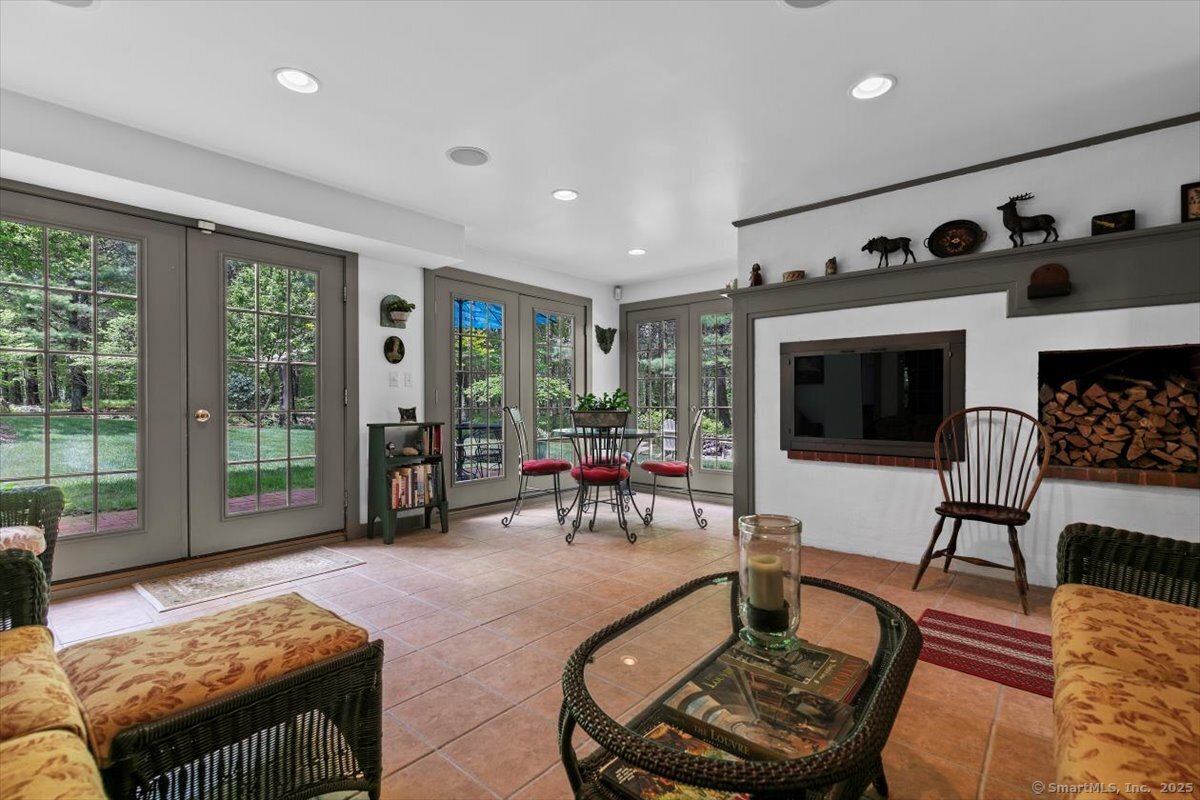 174 Bethel Road Griswold, CT 06351 - Photo 26 of 40 a living room with furniture and a floor to ceiling window