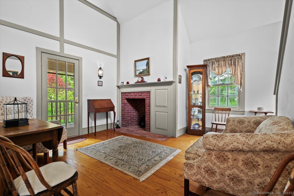 174 Bethel Road Griswold, CT 06351 - Photo 30 of 40 a living room with furniture and a fireplace