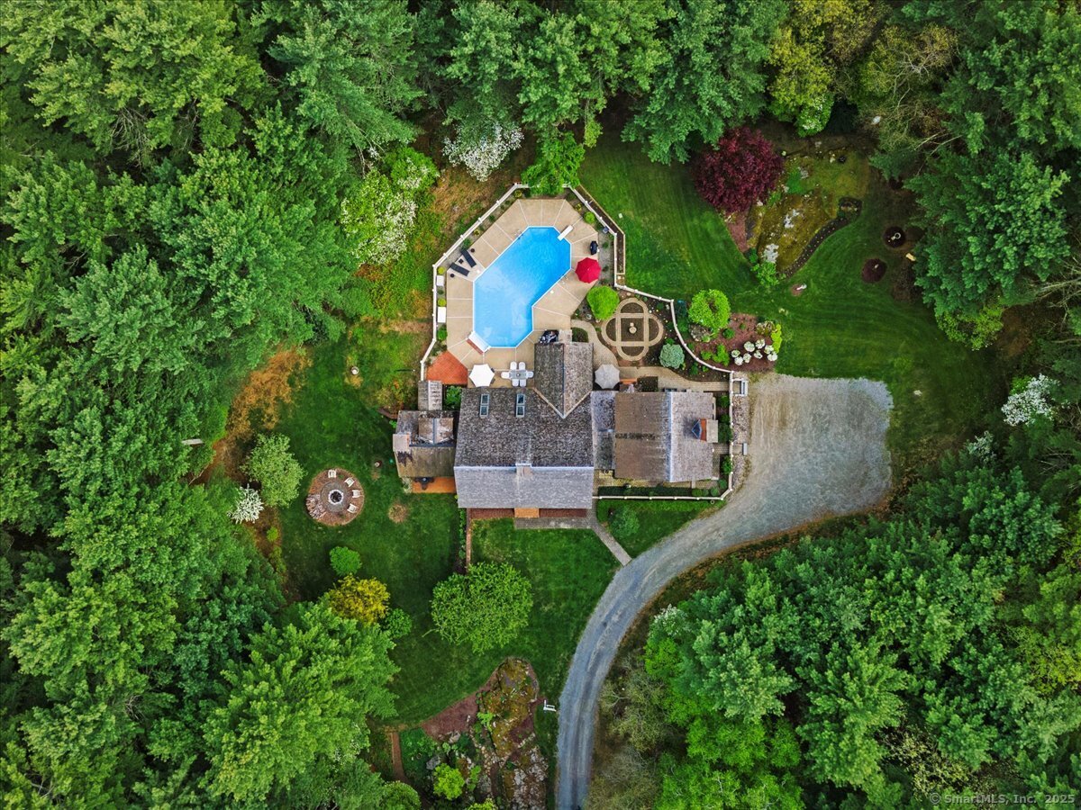 174 Bethel Road Griswold, CT 06351 - Photo 3 of 40 an aerial view of a house with outdoor space pool seating area and yard