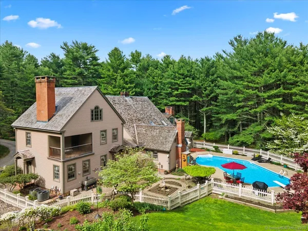 a aerial view of a house with swimming pool and garden