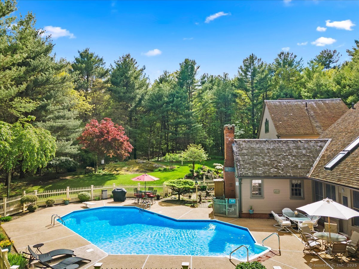 174 Bethel Road Griswold, CT 06351 - Photo 36 of 40 an outdoor space with furniture and umbrella