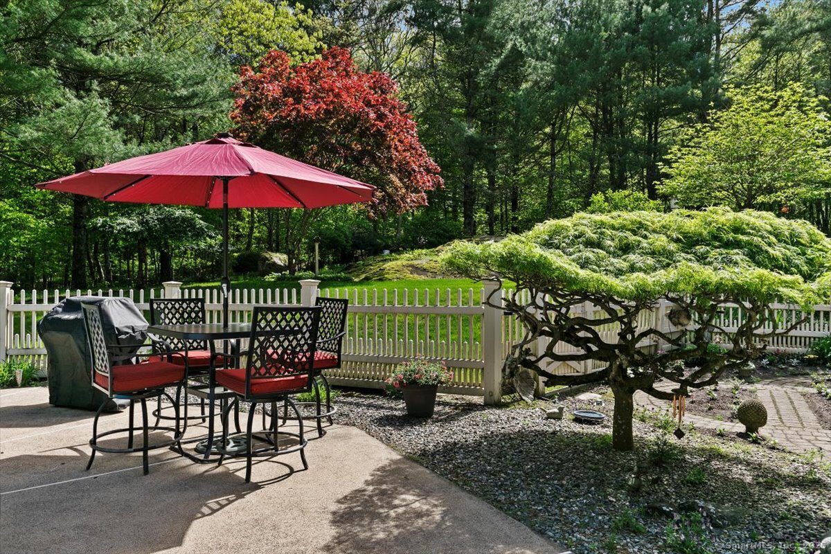 174 Bethel Road Griswold, CT 06351 - Photo 40 of 40 an outdoor sitting area with furniture and garden