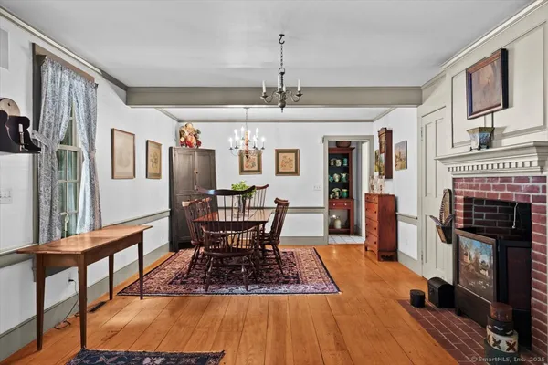 a view of a livingroom with furniture window and wooden floor