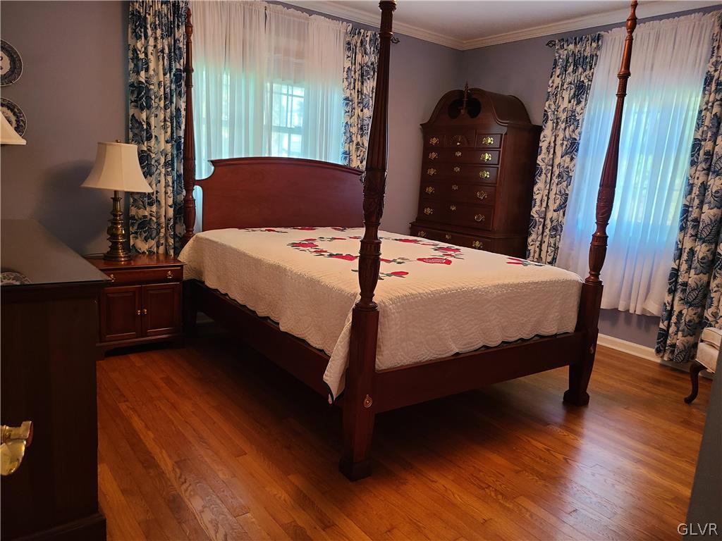 1922 Sycamore Street Bethlehem, PA 18017 - Photo 13 of 18 a bedroom with a bed lamp and a dresser