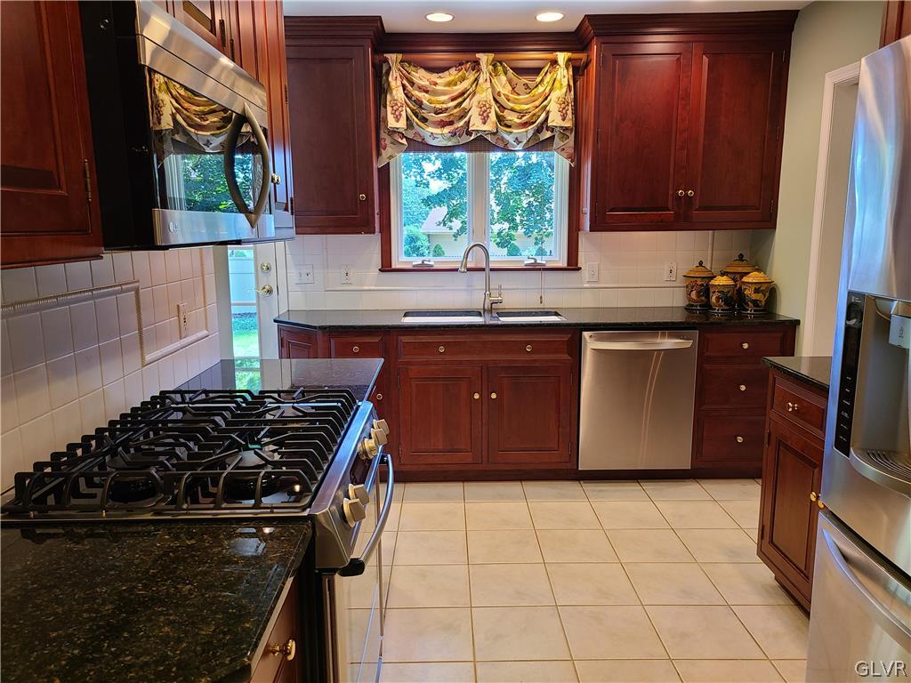 1922 Sycamore Street Bethlehem, PA 18017 - Photo 8 of 18 a kitchen with a stove a sink and a window