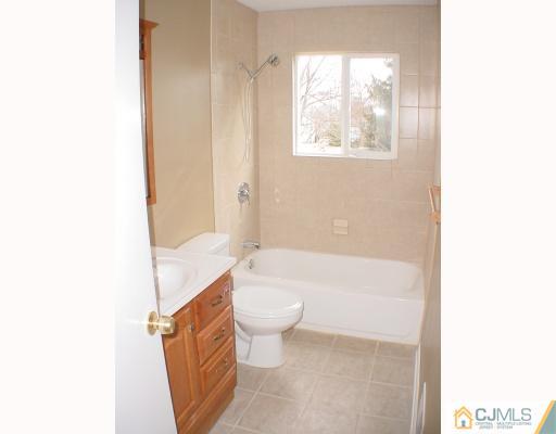 7 Barker Road Somerset, NJ 08873 - Photo 6 of 10 a bathroom with a toilet a sink and bathtub