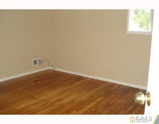 7 Barker Road Somerset, NJ 08873 - Photo 8 of 10 a view of an empty room and window