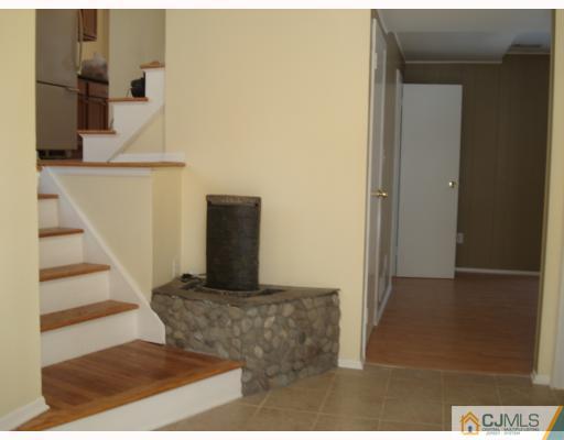 7 Barker Road Somerset, NJ 08873 - Photo 10 of 10 a view of a hallway with wooden floor and entryway
