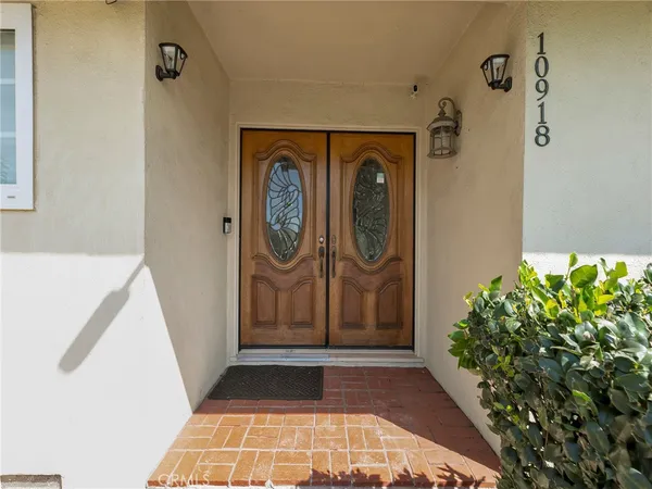 a view of a hallway with a washer and dryer