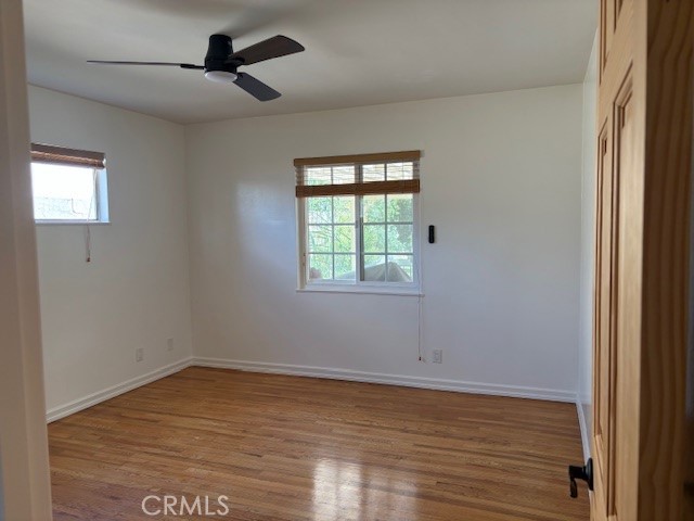 10918 Reseda Boulevard Porter Ranch, CA 91326 - Photo 15 of 19 a view of empty room with wooden floor and fan