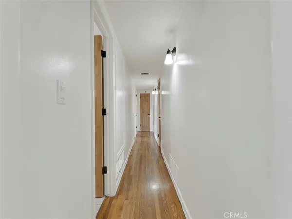 a view of a swimming pool with sitting area and furniture