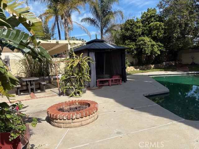 10918 Reseda Boulevard Porter Ranch, CA 91326 - Photo 17 of 19 a view of a chairs and tables in the patio