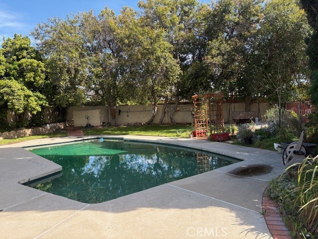 10918 Reseda Boulevard Porter Ranch, CA 91326 - Photo 18 of 19 a view of a swimming pool with a patio
