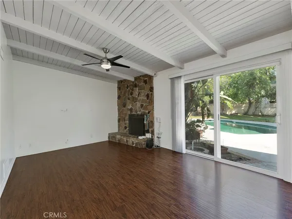 a kitchen with granite countertop a refrigerator and a stove
