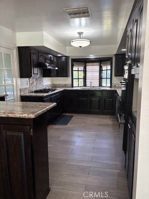 10918 Reseda Boulevard Porter Ranch, CA 91326 - Photo 5 of 19 a kitchen with a sink stainless steel appliances and cabinets