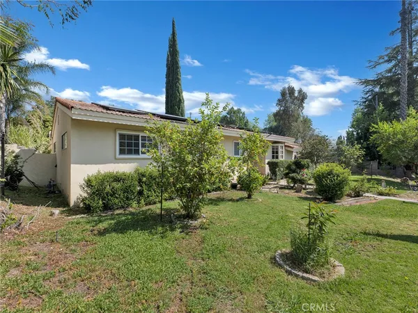 a bathroom with a double vanity sink a mirror and a bathtub