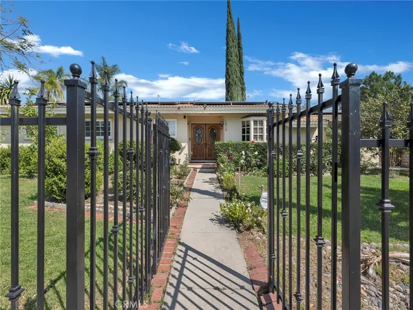 a kitchen with granite countertop stainless steel appliances and wooden cabinets