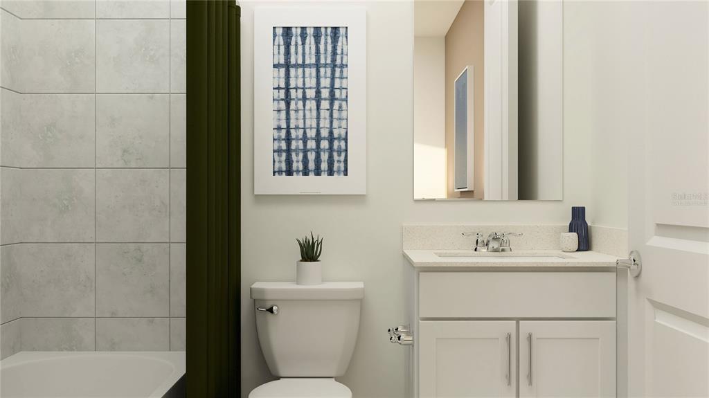 5635 Banyan Bay Road St. Cloud, FL 34771 - Photo 11 of 34 a bathroom with a sink toilet vanity and tub