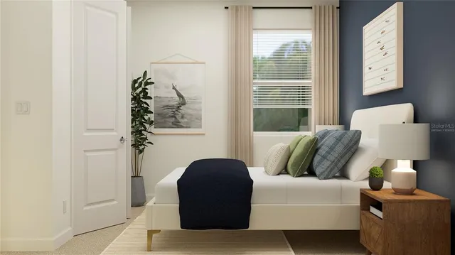 a bedroom with a bed and a window