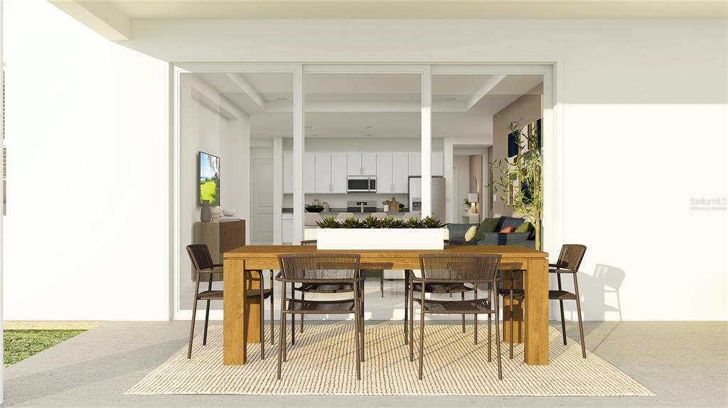 5635 Banyan Bay Road St. Cloud, FL 34771 - Photo 21 of 34 a kitchen with a table and chairs in it