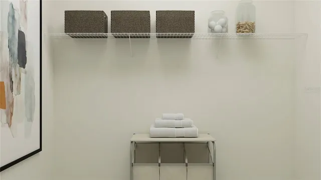 a view of walk in closet with empty racks