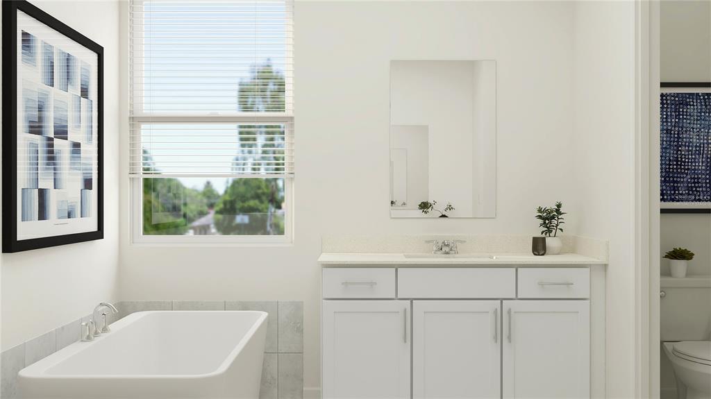 5635 Banyan Bay Road St. Cloud, FL 34771 - Photo 27 of 34 a bathroom with a sink and a bathtub