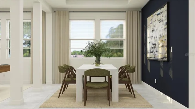 a view of a dining room with furniture and window