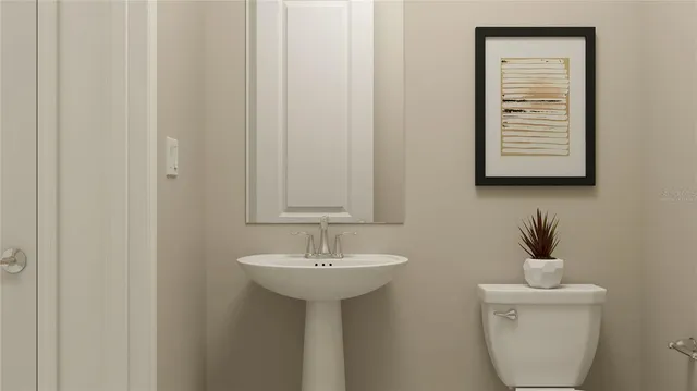 a bathroom with a sink a mirror and a toilet