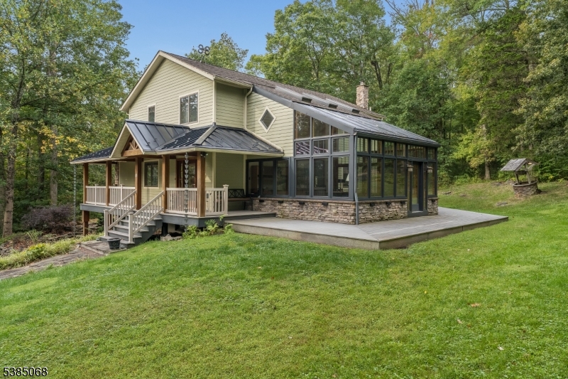 a front view of a house with a yard table and chairs