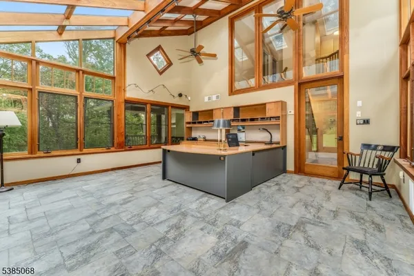 a view of a kitchen with a sink and cabinets