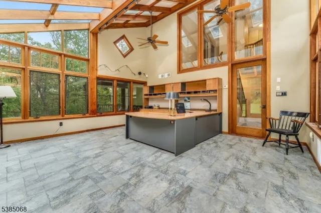 a view of a kitchen with a sink and cabinets