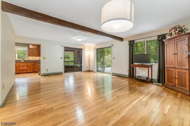 a bedroom with a bed dresser and a window
